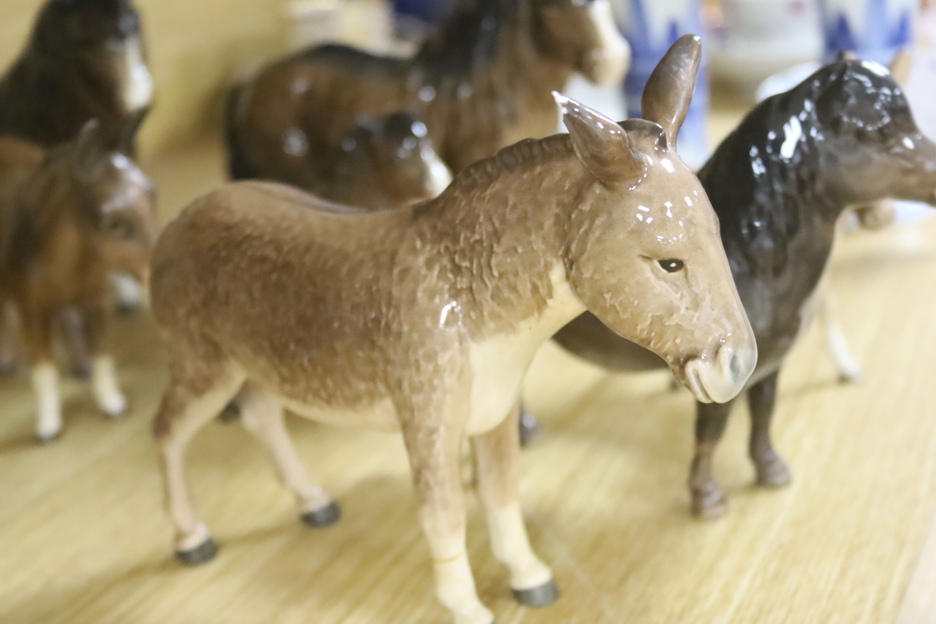 Four Beswick Shetland ponies and four Beswick donkeys